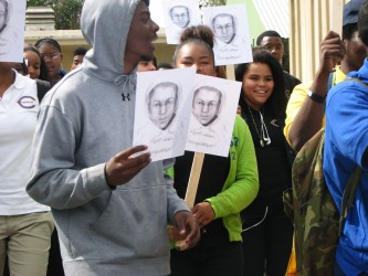 Marchers commemorating Martin Luther King's historic speech with a memorial to Trayvon Martin at Crenshaw High School.