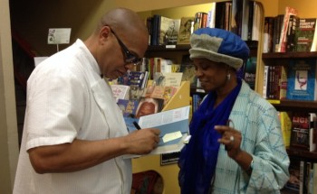 Chef Jeff signs a copy of his newest book at Eso Won Books.