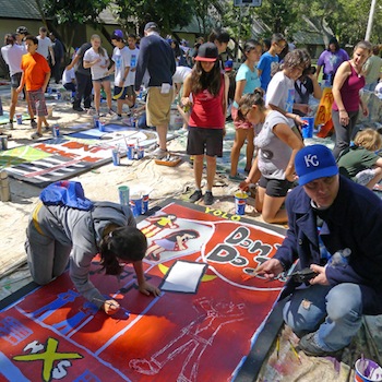 The children paint their flats on a camping trip | Photo Courtesy of Inside Out Community Arts