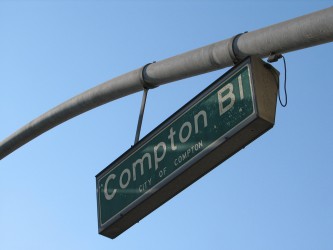 A sign for Compton Boulevard running through Compton. | Boo Reynolds / Flickr
