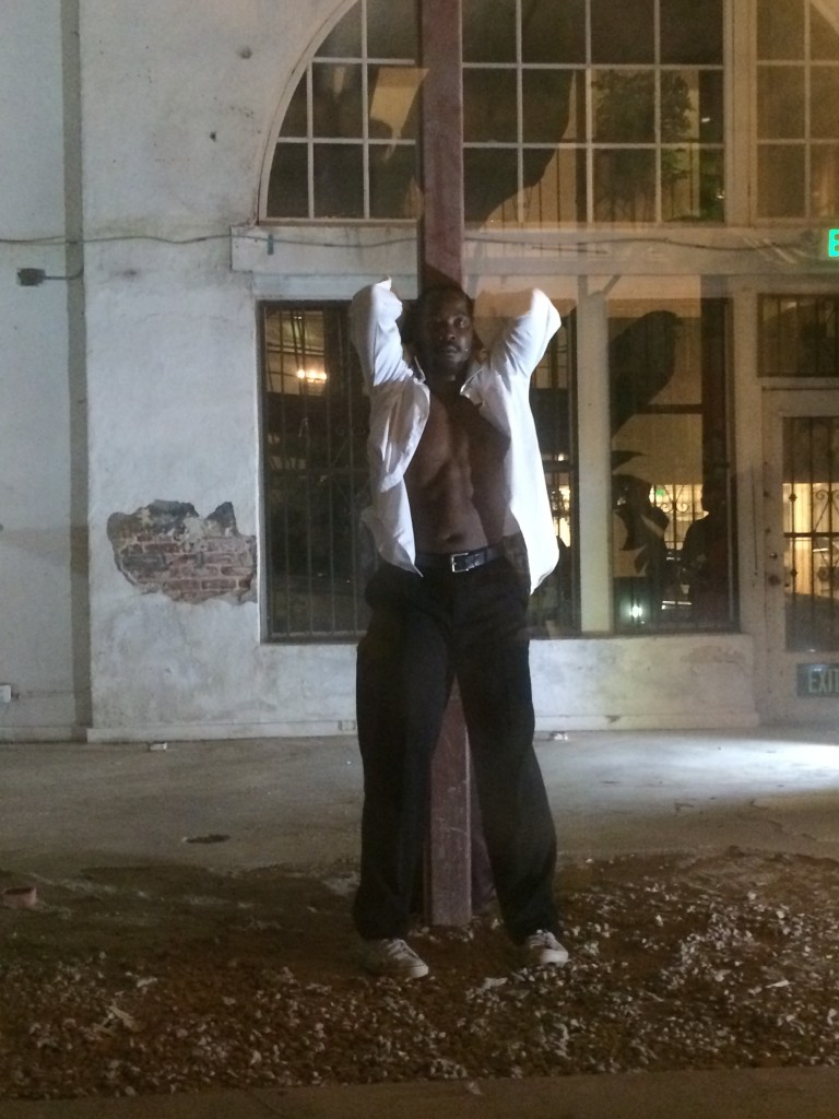 Dancer Wilfried Souly performs in the Dunbar Village's unoccupied storefront. | Christina Campodonico