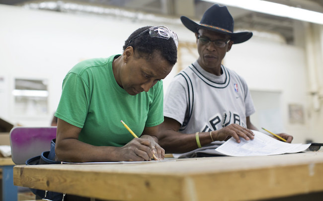 Students take a math test on the first day of a seven-week construction class at Los Angeles Trade Tech College on Monday, April 6, 2015. The class is aimed toward veterans, women and at-risk youth. | Photo by Maya Sugarman for KPCC