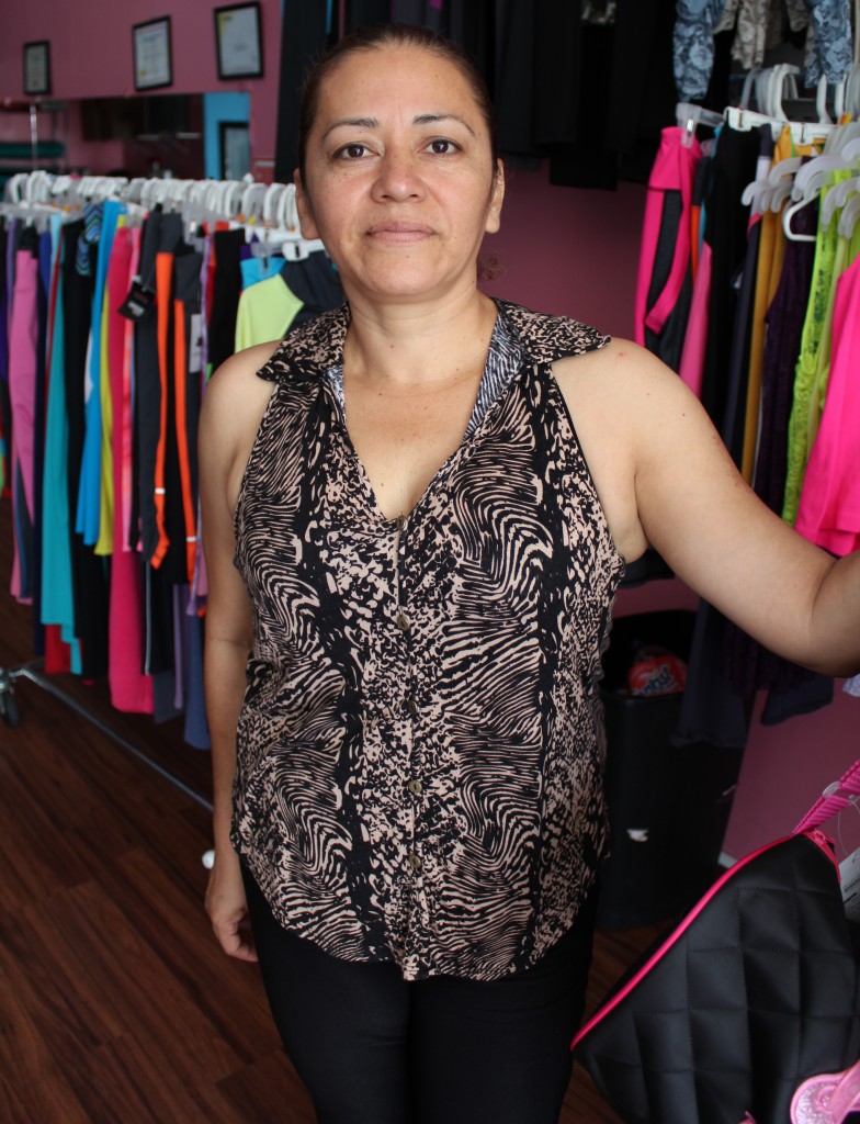 Santa Torijano sells colorful Zumba leggings and t-shirts to supplement her income from class fees. | Daina Beth Solomon