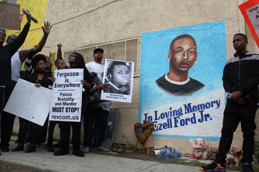 Ferguson protesters reach the site where Ezell Ford was killed last August. | Daina Beth Solomon