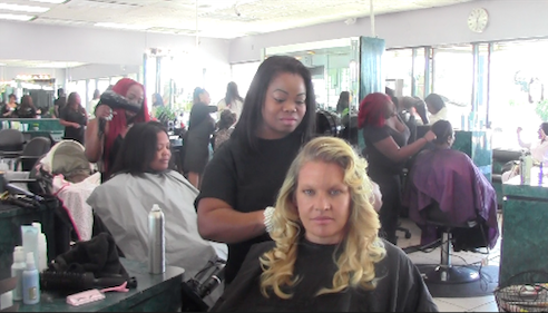 Hair stylist Aja Marie Chaff gives back to the community by cutting hair on Pamper Me Day. | Photo by Mirian Fuentes